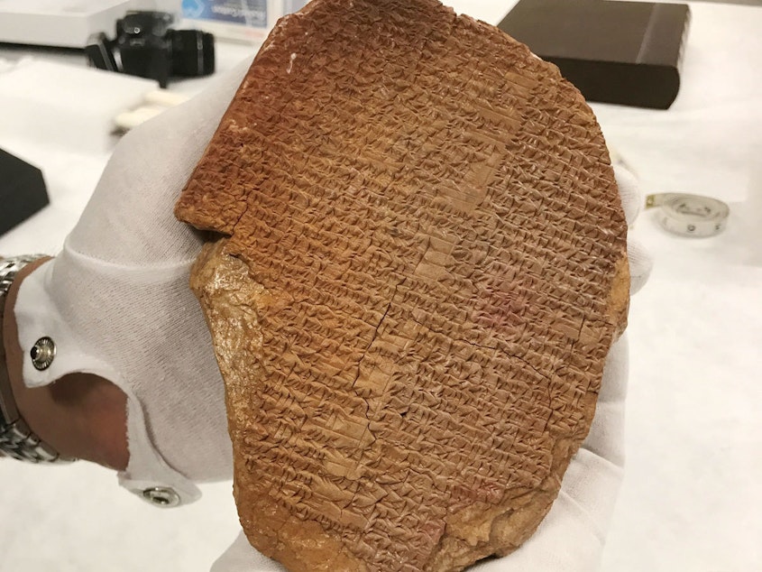 caption: Hobby Lobby bought the Gilgamesh Dream Tablet for more than $1.6 million in 2014. "This rare tablet was pillaged from Iraq and years later sold at a major auction house, with a questionable and unsupported provenance," Peter C. Fitzhugh, special agent in charge for Homeland Security Investigations in New York, said in a statement.