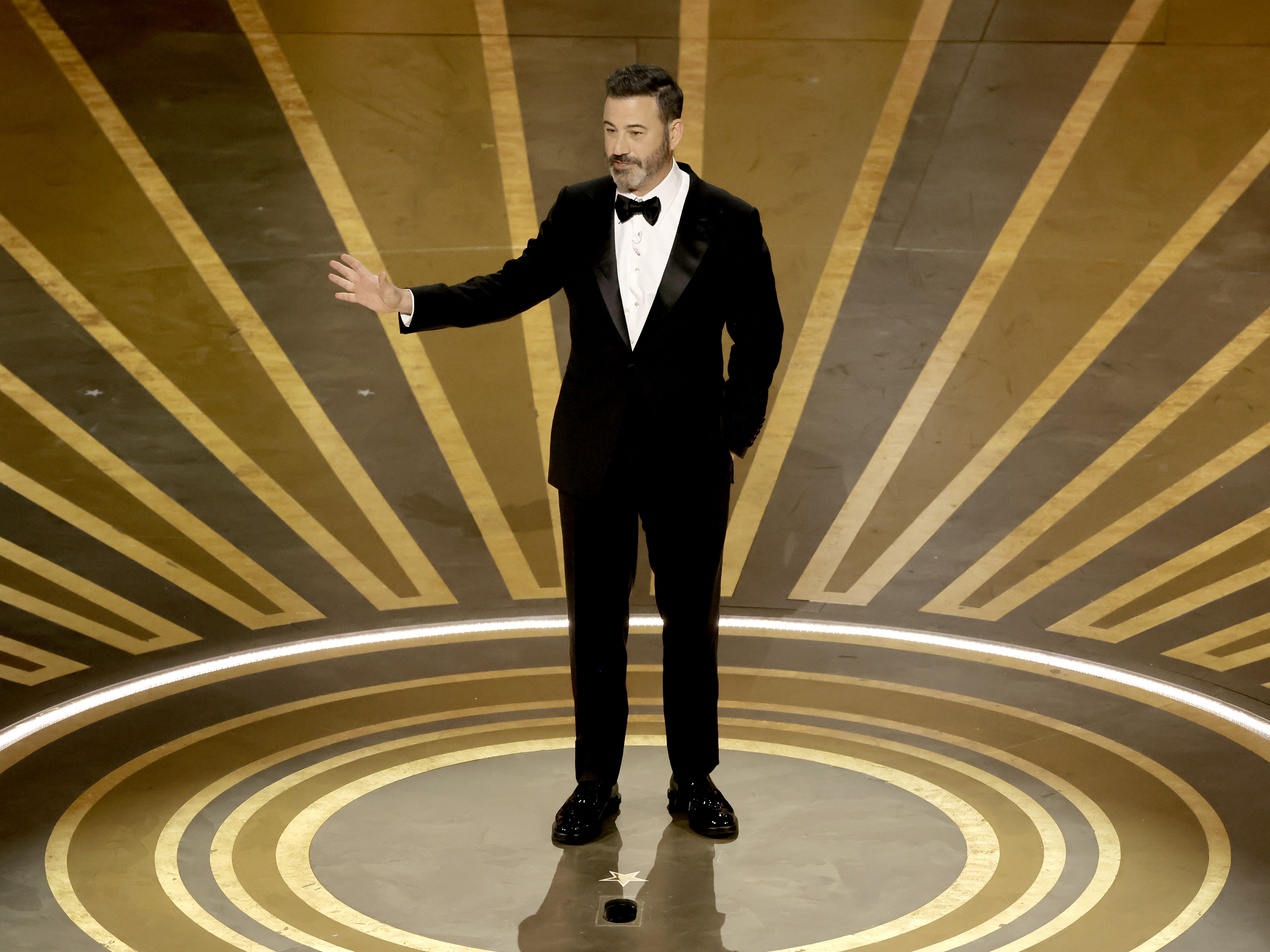 caption: Jimmy Kimmel at the 95th Annual Academy Awards in 2023. The Sinclair and Nexstar broadcast groups restored the late night TV host's show to their stations after taking it off the air for more than a week following comments he made about the suspect in Charlie Kirk's killing.
