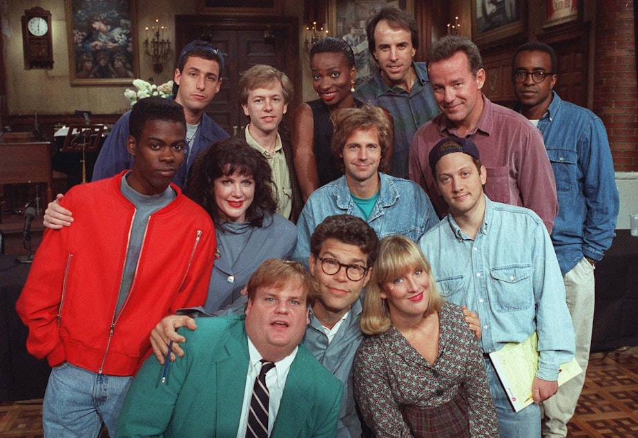 caption: The cast of NBC's "Saturday Night Live" pose on the show's set in New York, Sept. 22, 1992. From left, front row, are: Chris Farley, Al Franken and Melanie Hutsell. In middle row, from left, are: Chris Rock, Julia Sweeney, Dana Carvey and Rob Schneider. In back row, from left, are: Adam Sandler, David Spade, Ellen Cleghorne, Kevin Nealon, Phil Hartman and Tim Meadows. 