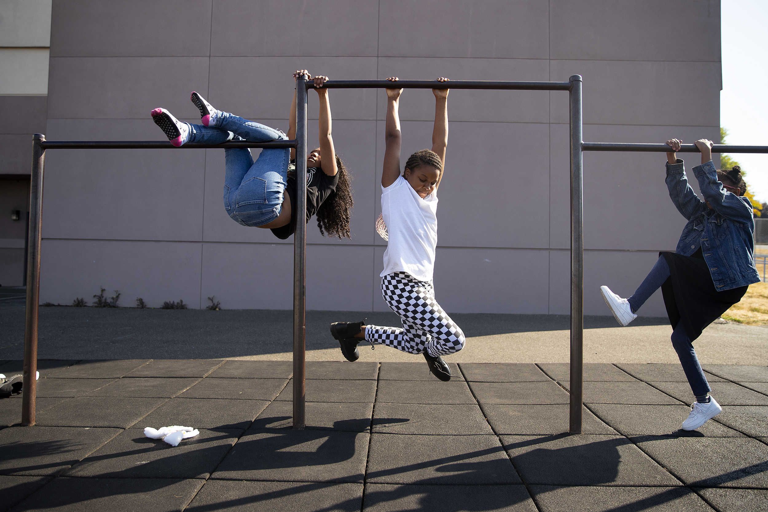 caption: Amari Dewater, a 4th-grade-student at Jennie Reed Elementary, plays with classmates during recess on Monday, September 26, 2022, on the school’s playground  in Tacoma. 