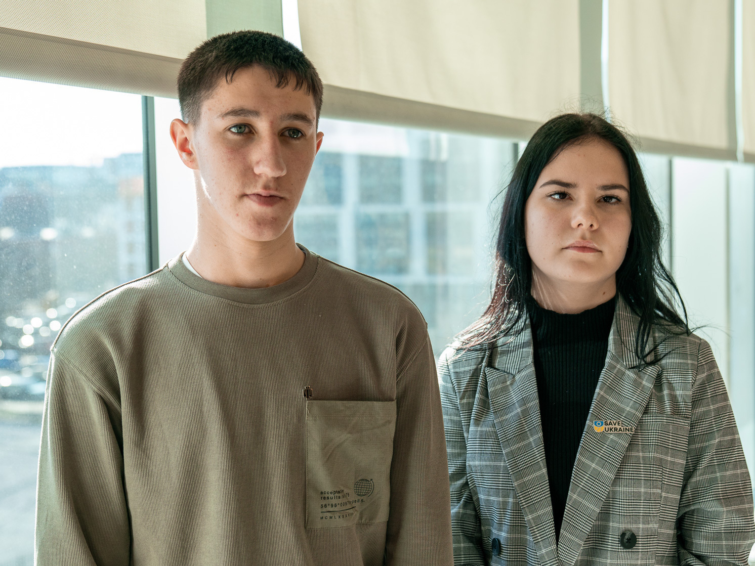 caption: Rostislav (left) and Ksenia were abducted from Ukraine during the war with Russia.