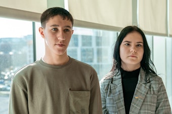 caption: Rostislav (left) and Ksenia were abducted from Ukraine during the war with Russia.