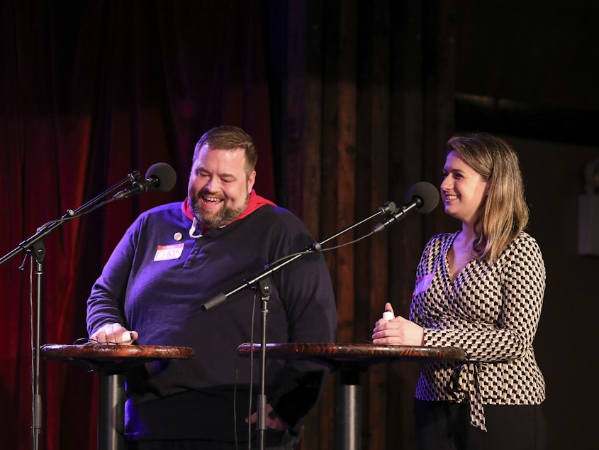 caption: Contestants Chris Cyr and Julia Kaplan appear on <em>Ask Me Another</em> at the Bell House in Brooklyn, New York.