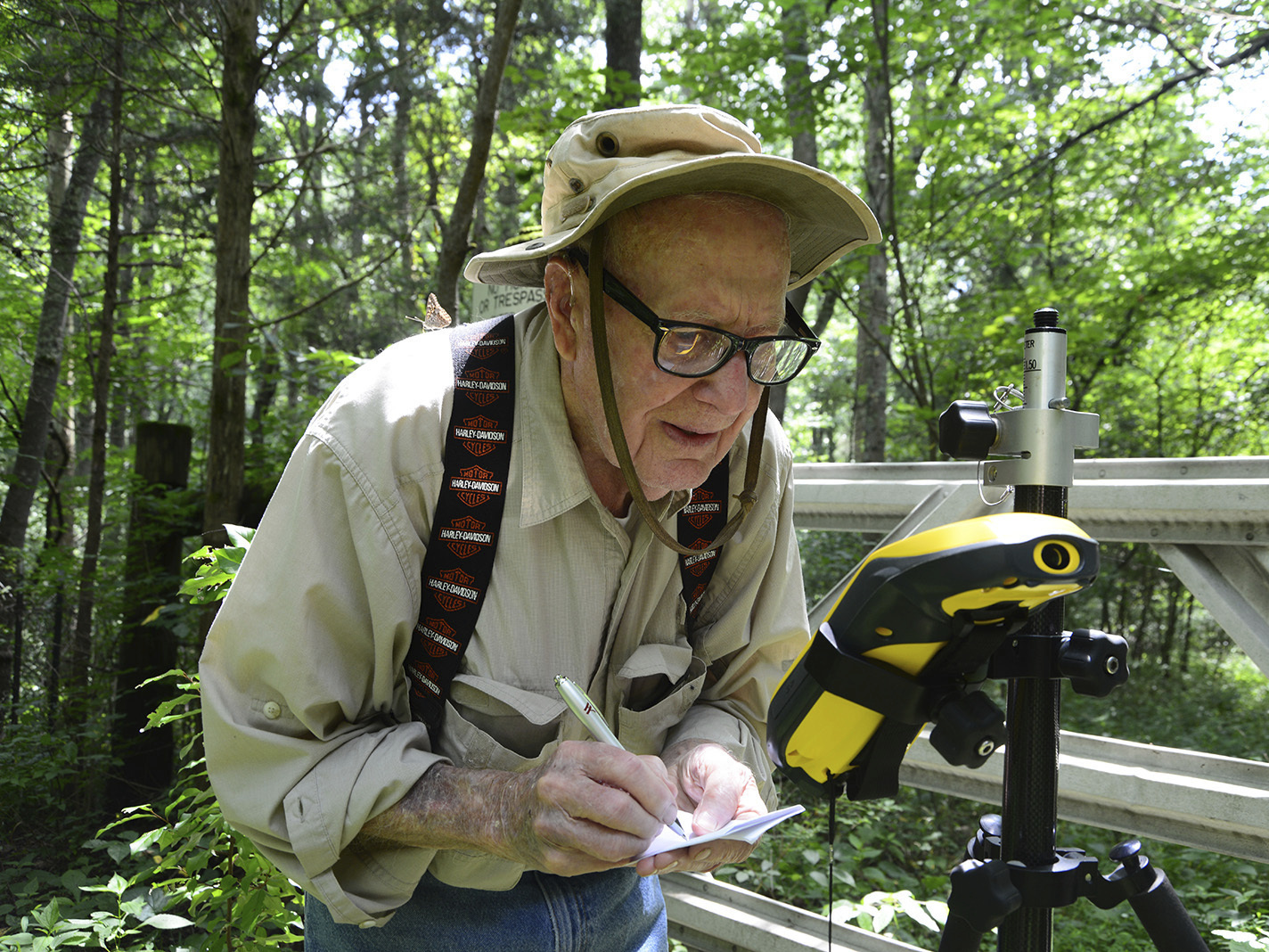 caption: Bob Vollmer, seen in a 2016 photograph provided by the Indiana Department of Natural Resources, shows the now-102-year-old at work. The state's oldest employee plans to retire next month, after nearly six decades on the job.