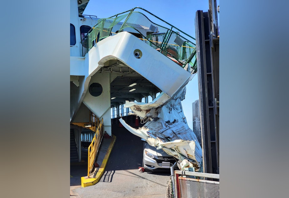 caption: The Cathlamet ferry is shown after crashing into the Fauntleroy ferry terminal causing significant damage on Thursday, July 28, 2022, in Seattle. 