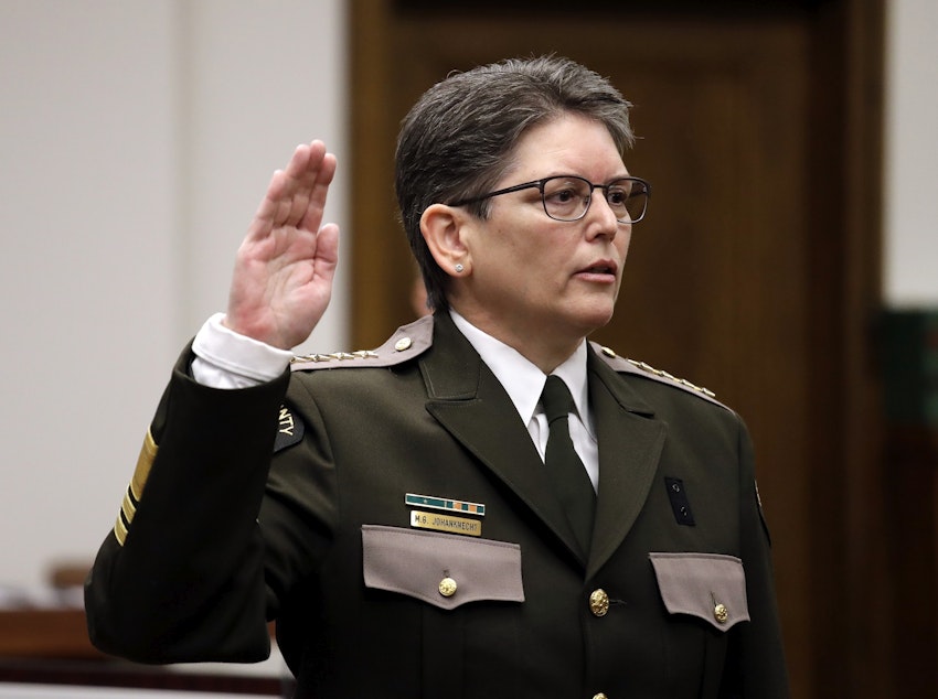 caption: A file photo King County Sheriff Mitzi Johanknecht being sworn in on Jan. 2, 2018, in Seattle. Johanknecht was elected to the position. A ballot measure asks voters to decide whether the position should be appointed. 