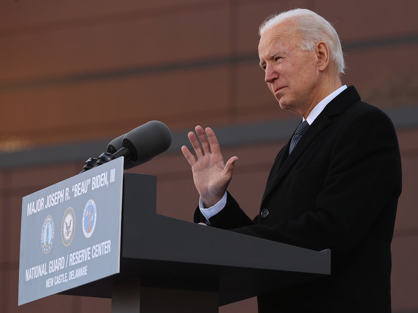 caption: One day before being inaugurated as the 46th president of the United States, President-elect Joe Biden delivers remarks Tuesday at the Maj. Joseph R. "Beau" Biden III National Guard/Reserve Center in New Castle, Del.