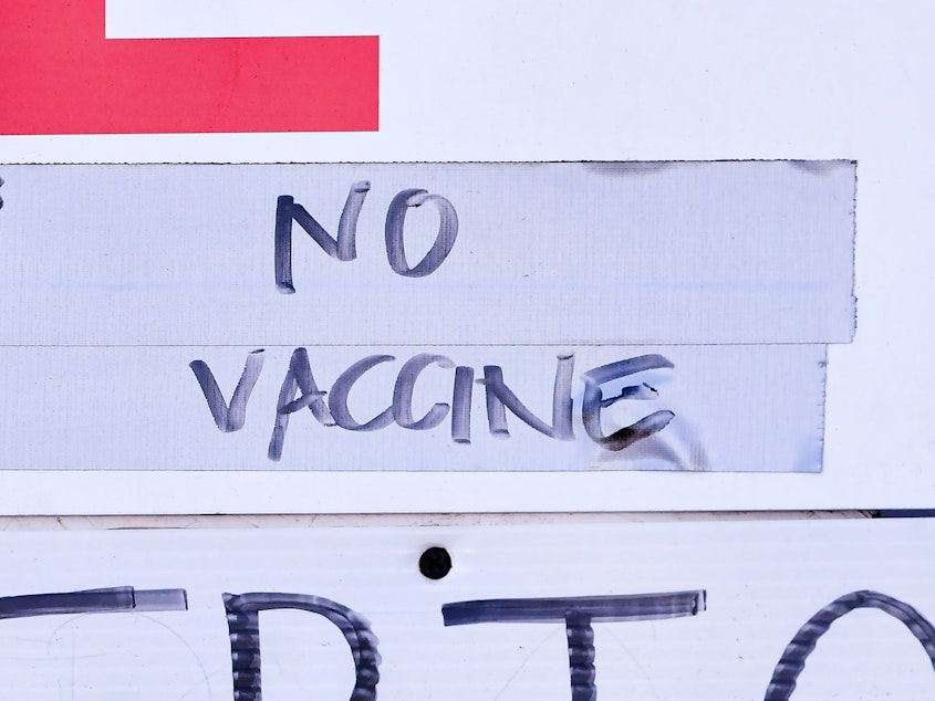 caption: A sign at a vaccination site in Los Angeles reflects the holdup in vaccine distribution as a result of this week's storms. White House officials said Friday that the extreme weather delayed the shipment of some 6 million doses across the country.