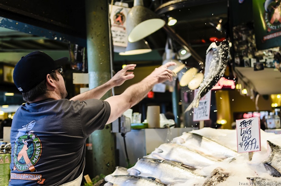 caption: A fisherman tosses a fish at Pike Place Market - which, along with the Space Needle and perhaps also the vista from a ferry, is the only thing you need to toss into an opening montage for people to know a movie is set in Seattle.