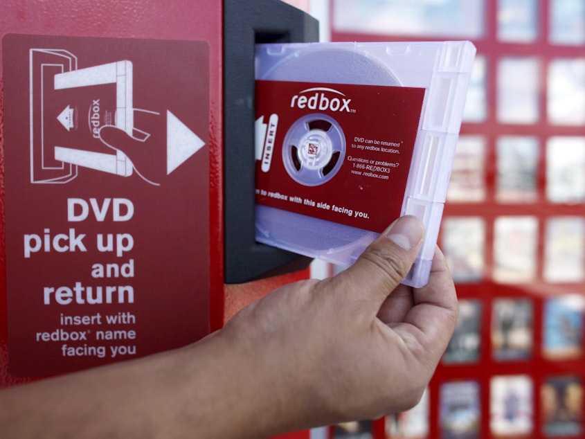caption: A rental DVD is dispensed from a Redbox at a 7-Eleven in Los Angeles in 2009. Chicken Soup for the Soul Entertainment, the owner of Redbox, filed for Chapter 11 bankruptcy protection on Friday.