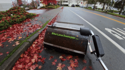caption: The bike lane sweeper in action on a recent fall day in Kirkland.