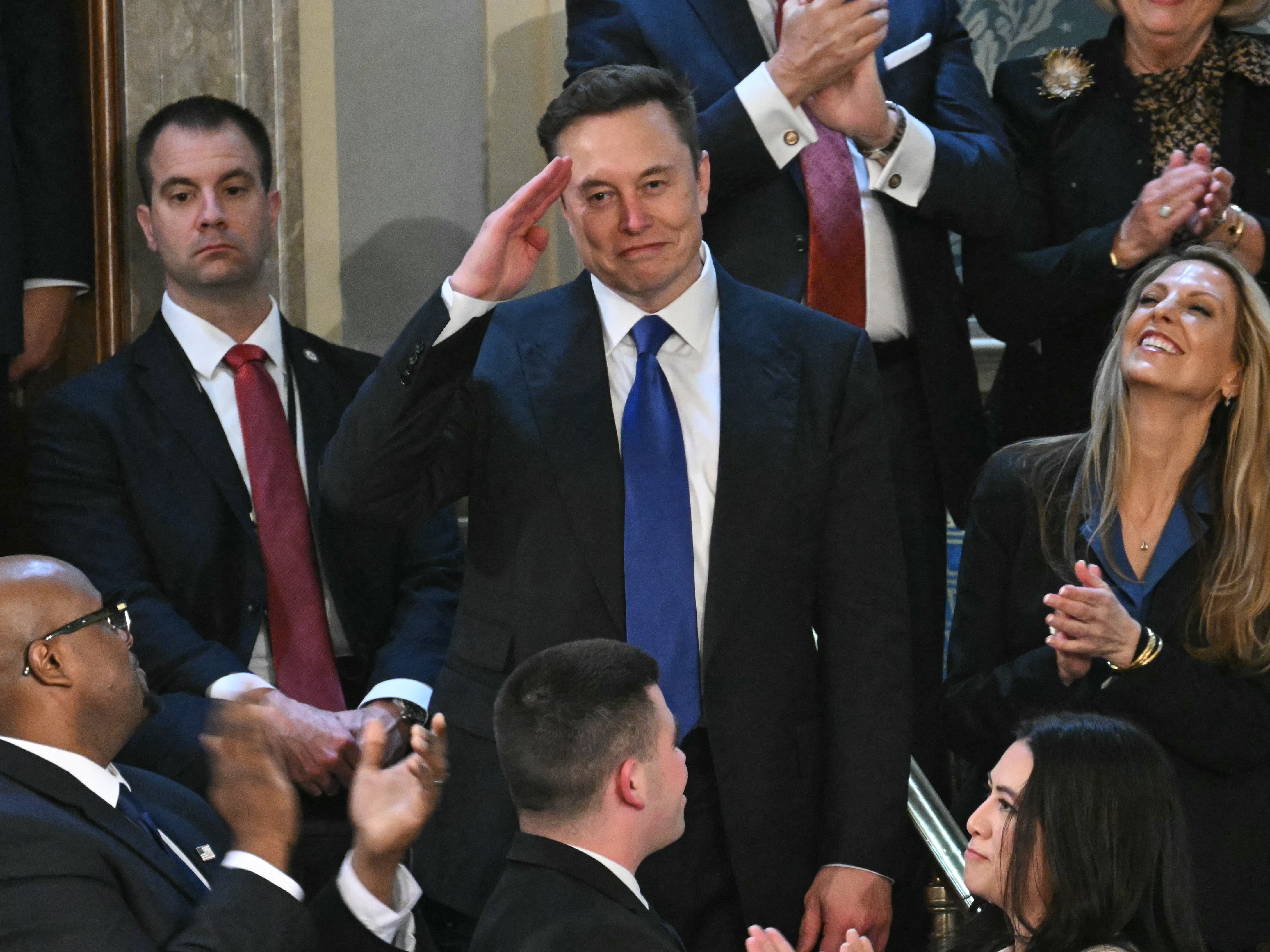 caption: Elon Musk stands as he is recognized by President Trump during the latter's address to a joint session of Congress on Tuesday.