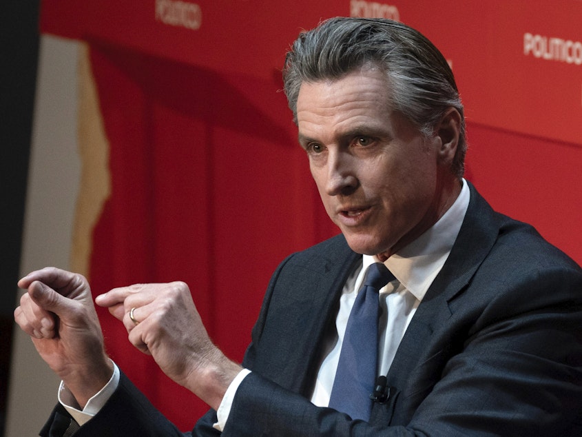 caption: California Gov. Gavin Newsom speaks during an interview in Sacramento, Calif., on Tuesday, Sept. 12, 2023. Newsom signed a bill on Monday, Sept. 25, 2023, to ban school boards from rejecting textbooks based on their teachings about the contributions of people from different racial backgrounds, sexual orientations and gender identities, calling the measure "long overdue."