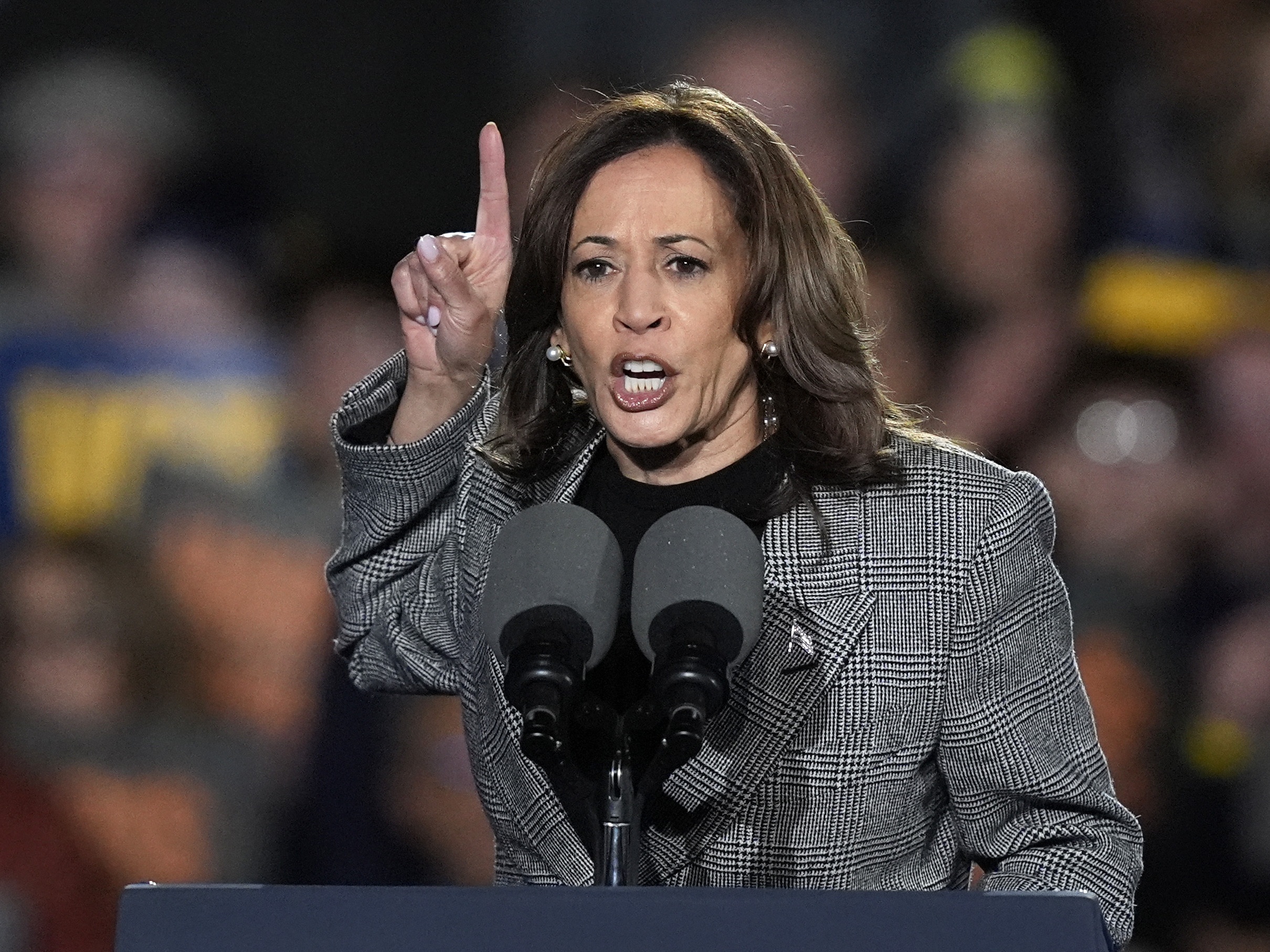 caption: Vice President Harris speaks during a campaign rally in Ann Arbor, Mich., on Oct. 28, 2024.