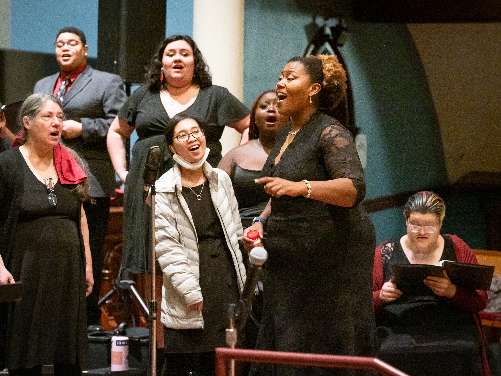 caption: Coty Raven Morris conducts the combined Rose and Thorn Choirs singing an African piece called "Modimo" at the <a href="https://www.pdx.edu/arts/events/from-the-dust1">From the Dust</a> concert performed at First Congregational Church in Portland in November, 2023.