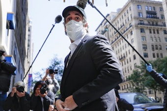 caption: A federal judge found that Michael Cohen's return to prison earlier this month was a violation of his first amendment rights. Cohen, shown here in May, had previously been granted home due to coronavirus concerns.