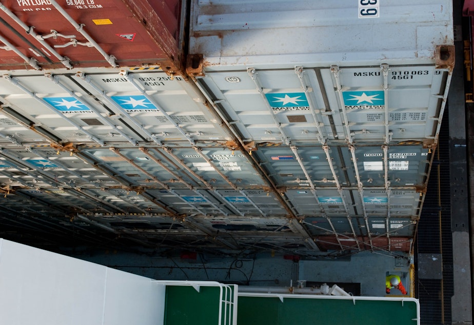 caption: Containers stacked high at the Port of Seattle.