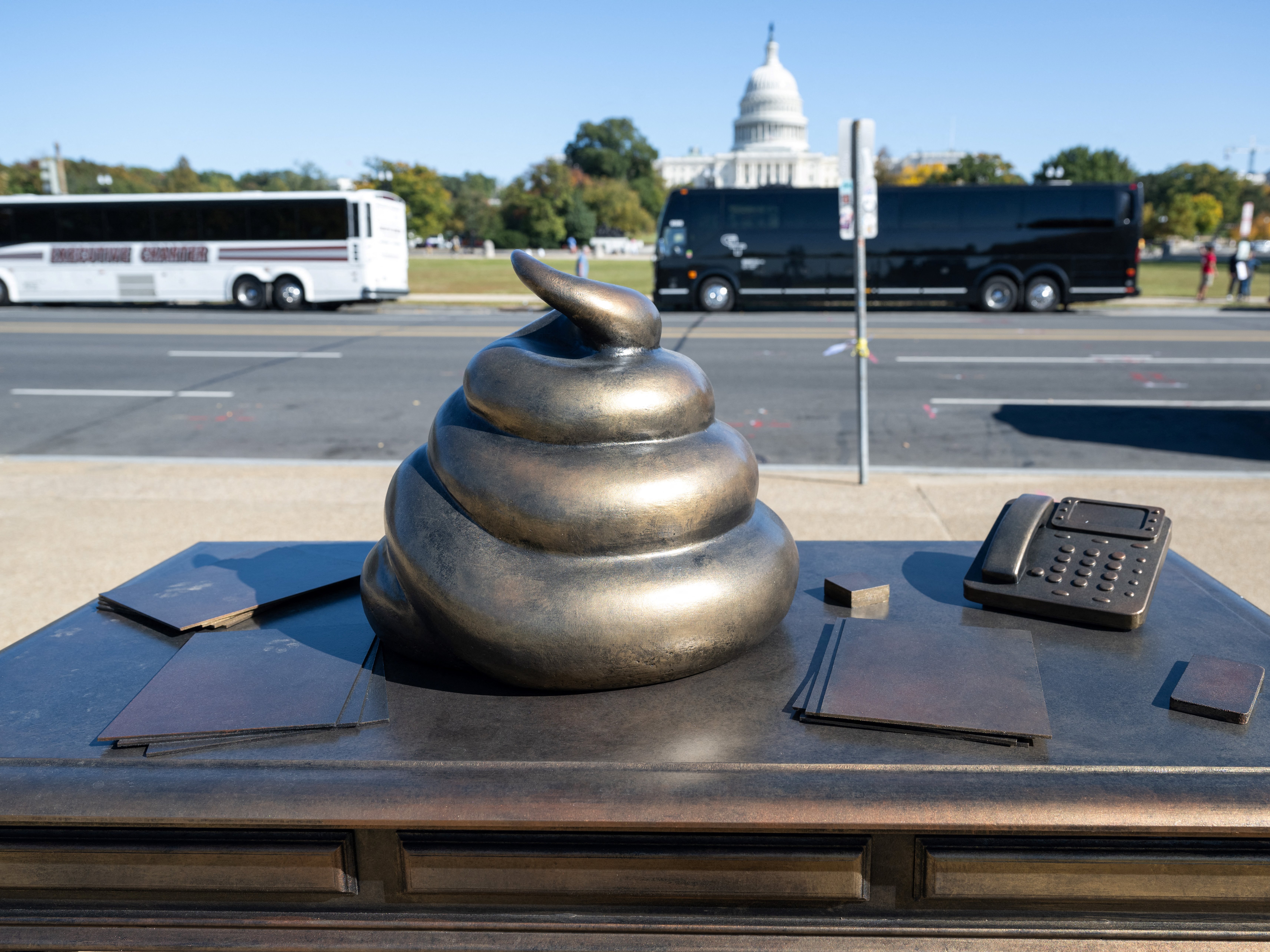 KUOW - A statue of Trump and Epstein holding hands in D.C. is removed as  fast as it appeared