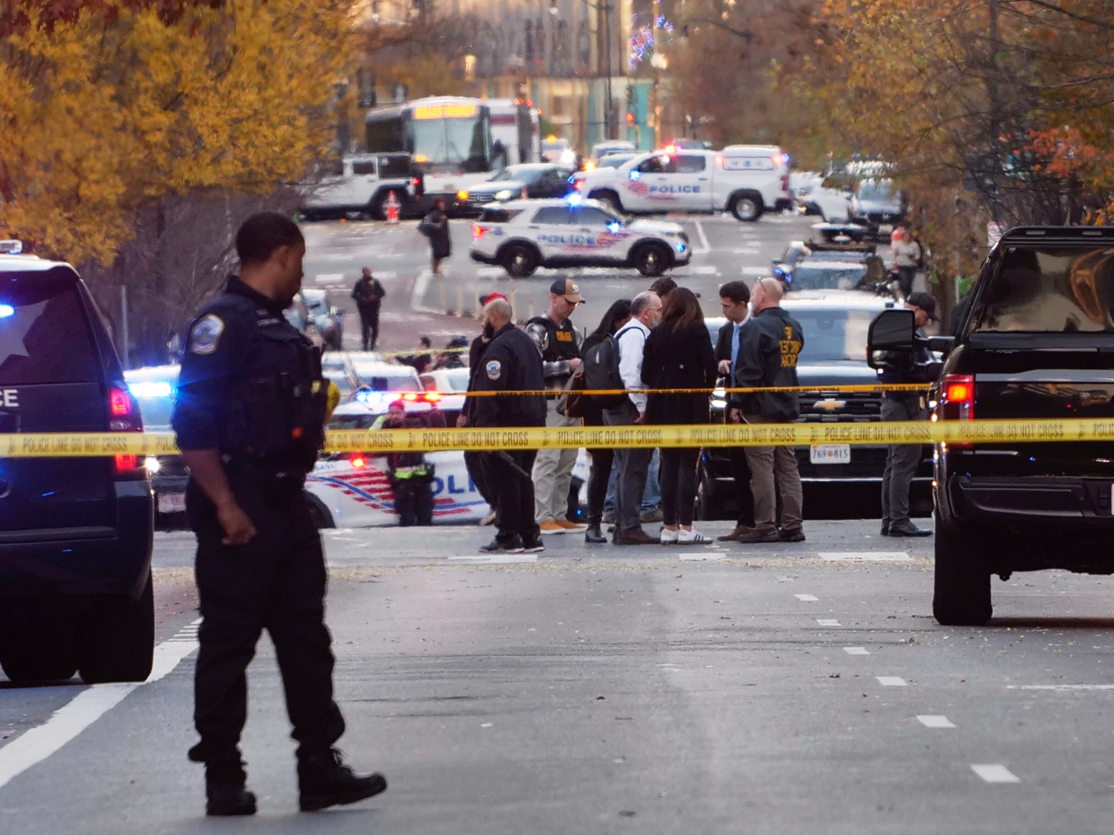 caption: Streets are blocked after reports that two National Guard soldiers were shot near the White House in Washington on Wednesday.