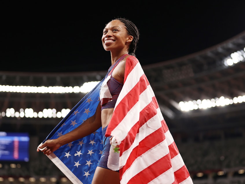 caption: Allyson Felix of Team USA celebrates after winning the bronze medal in the women's 400m Final at the Tokyo Olympic Games on Friday.