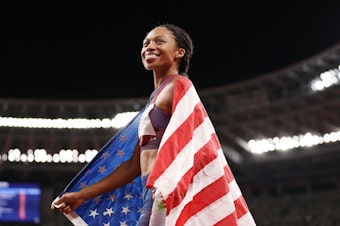 caption: Allyson Felix of Team USA celebrates after winning the bronze medal in the women's 400m Final at the Tokyo Olympic Games on Friday.