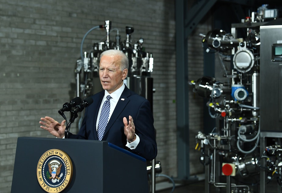 caption: President Biden speaks Friday at a Pfizer COVID-19 vaccine manufacturing site in Portage, Mich. The House could pass a version of his $1.9 trillion COVID-19 relief legislation this week.
