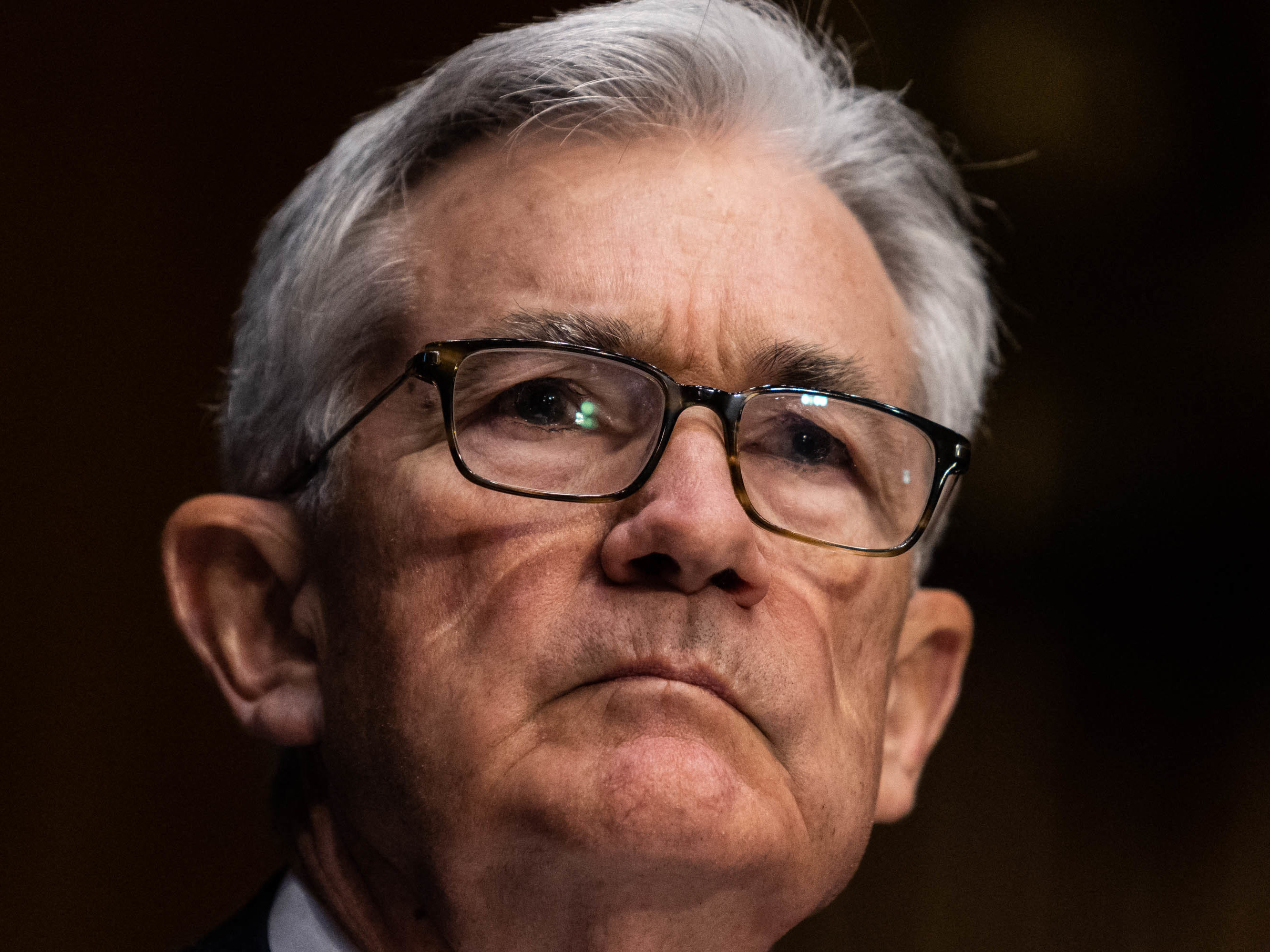 caption: Federal Reserve Chair Jerome Powell listens during his renomination hearing with the Senate Banking Committee on Jan. 11. The Fed is planning to become more aggressive in fighting inflation.