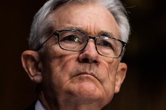 caption: Federal Reserve Chair Jerome Powell listens during his renomination hearing with the Senate Banking Committee on Jan. 11. The Fed is planning to become more aggressive in fighting inflation.