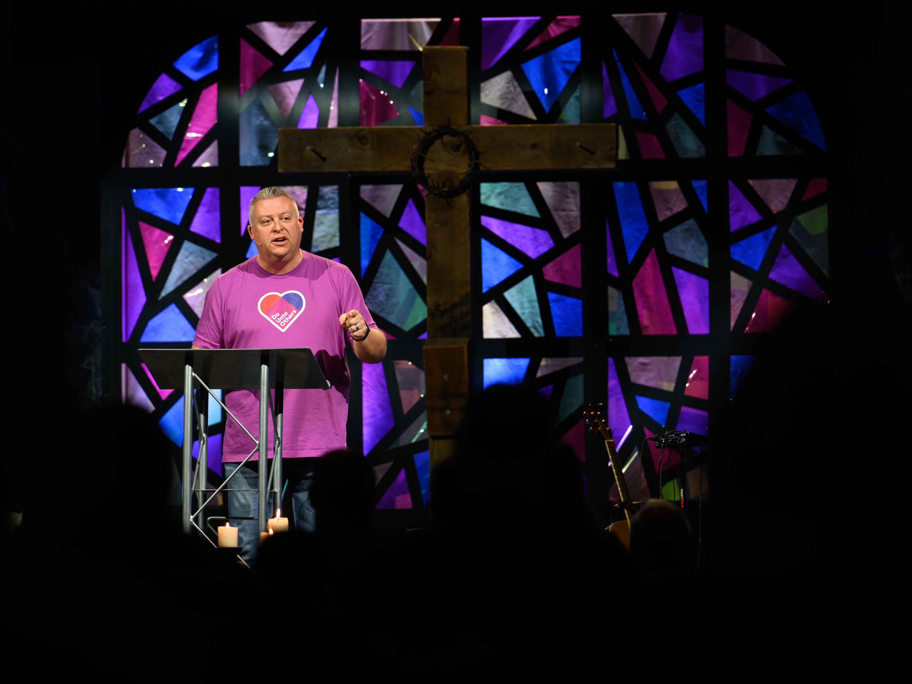 caption: Pastor Chris Morgan leads a contemporary service at Christ United Methodist Church in Bethel Park, Pa., on the Sunday after Election Day. The church developed a sermon series called "Do Unto Others" to help parishioners navigate political divisions after the election. Justin Merriman for NPR