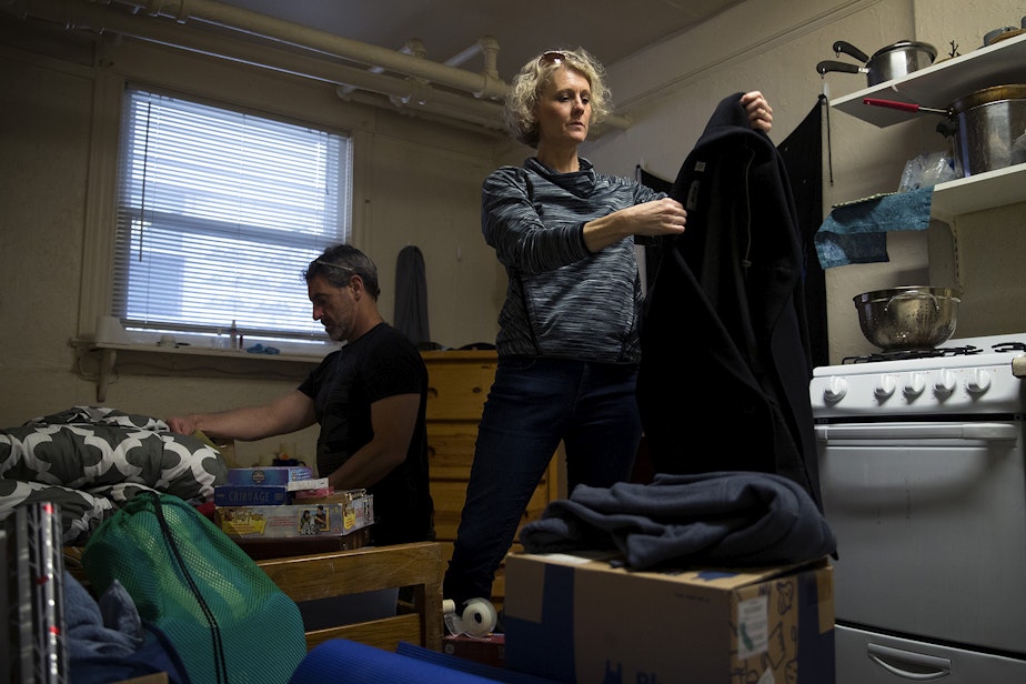 caption: Jerri and Matt Clark pack up their son Calvin's apartment on Friday, March 22, 2019, in Seattle. 