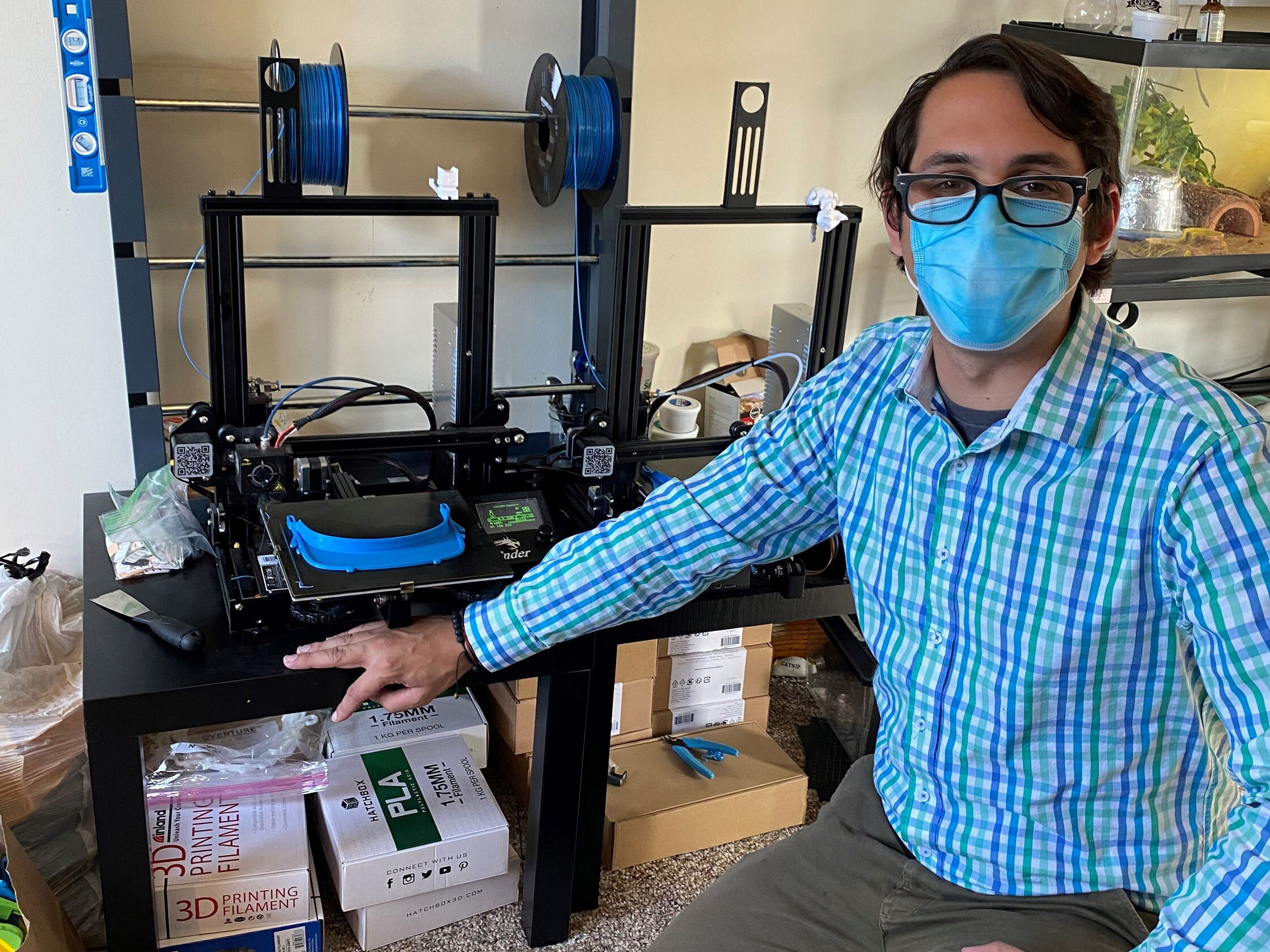 caption: Jacob Ezzo, a chorus teacher from South Orange Middle School in New Jersey, has helped spearhead an effort to make face shields for those working on the front lines of the coronavirus pandemic.
