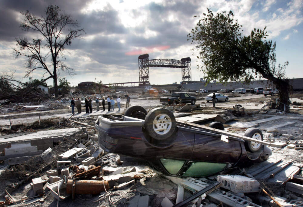 caption: Members of the Louisiana Recovery Authority tour New Orleans' hurricane-ravaged Lower 9th Ward in 2005. (Robert F. Bukaty/AP)