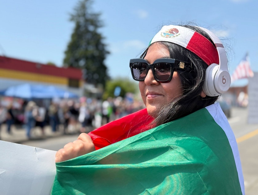 caption: Jessica Garcia of Newberg, attending the ‘No Kings’ rally in Newburg, Ore., June 14, 2025. Garcia says she was the only person protesting earlier in the week after ICE carried out at least two known arrests here that same day.