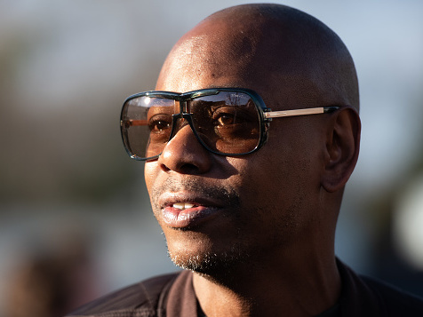 caption: <em>Dave Chappelle: This Time This Place</em> chronicles Chappelle's efforts to entertain audiences during the pandemic with a series of outdoor shows. He's pictured above in North Charleston, S.C., on Jan. 30, 2020.
