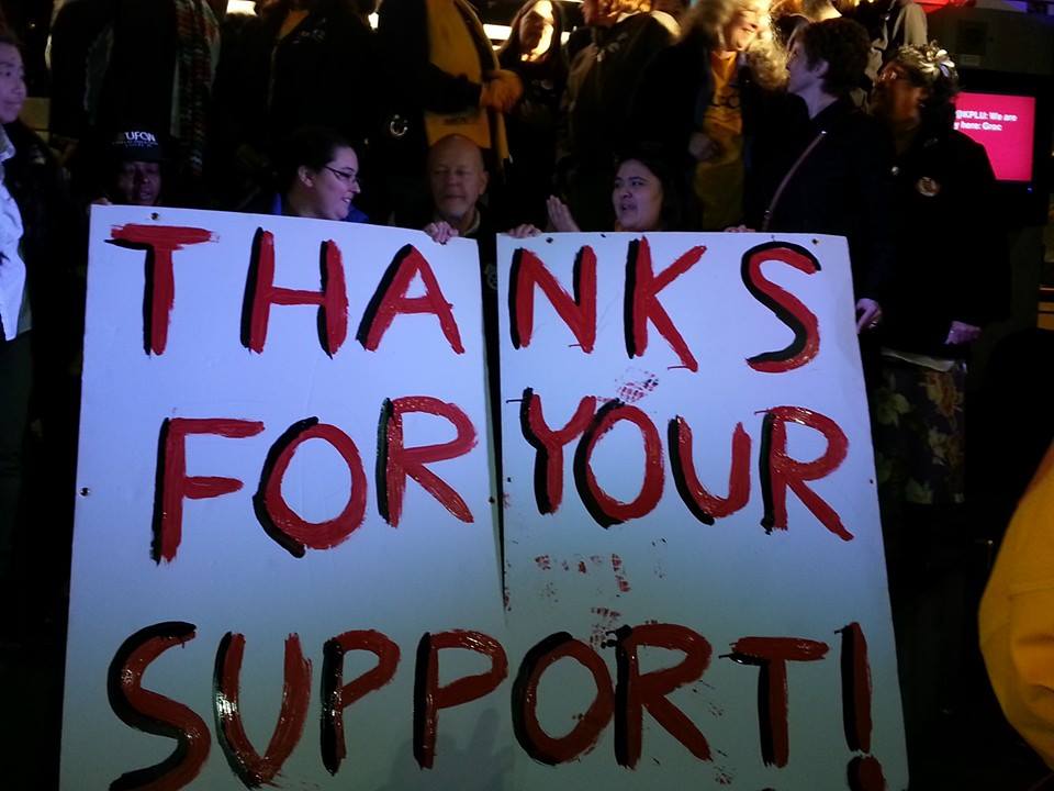 caption: Grocery workers gathered at Westlake Center in downtown Seattle to countdown to a strike that was narrowly avoided late Monday.