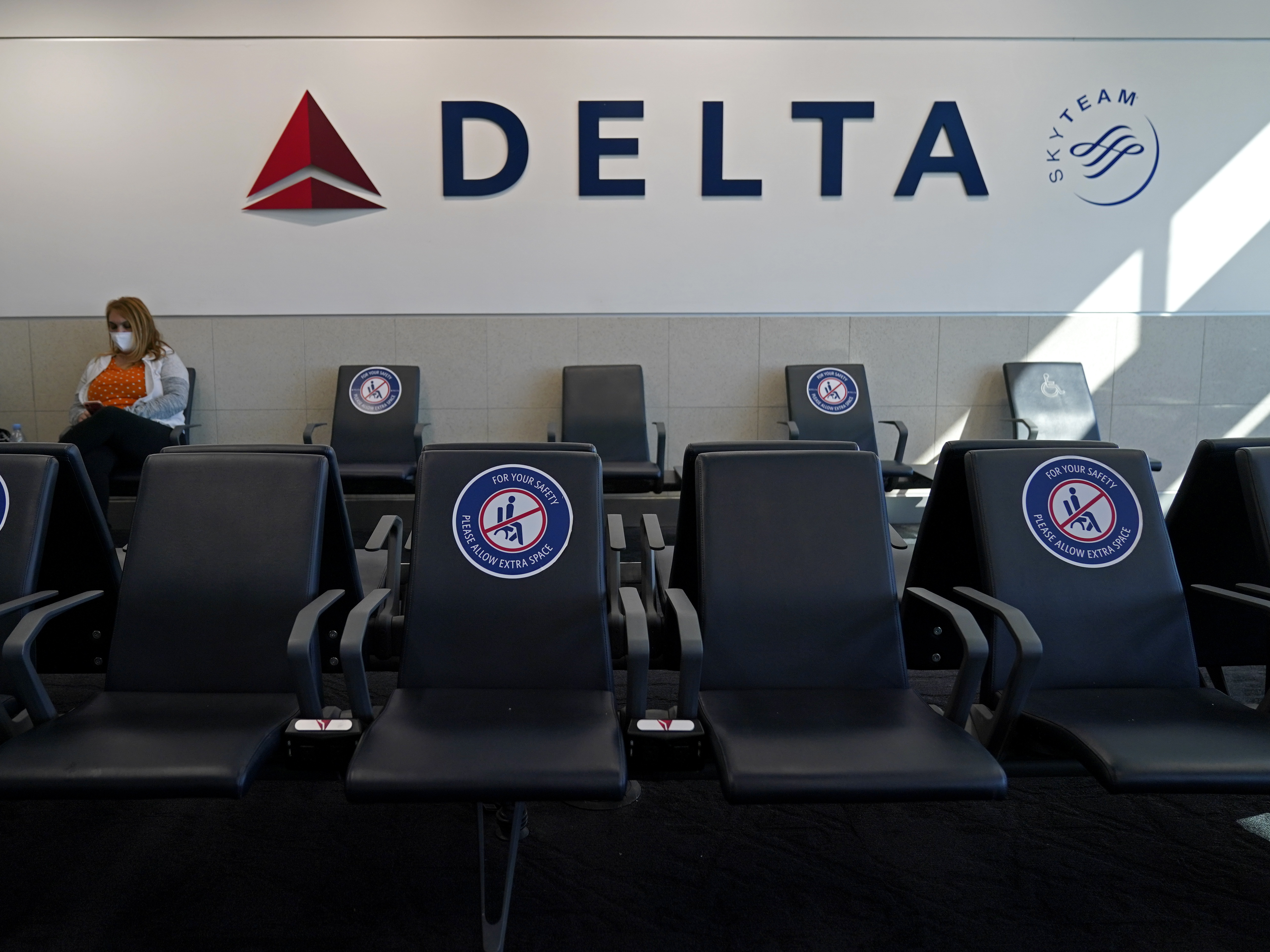 caption: Delta Air Lines will start paying flight attendants for the time that passengers are boarding. That's a first for a major U.S. airline. Flight attendants in the U.S. generally don't begin getting paid until the doors close after boarding.