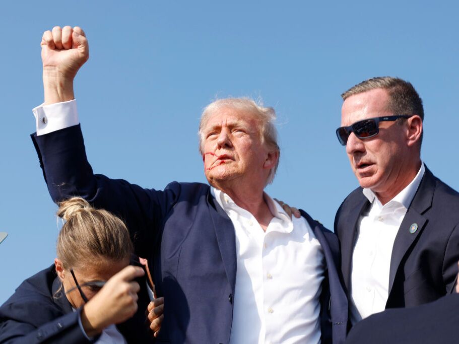 caption: Former President Donald Trump is rushed offstage during a rally in in Butler, Pa. 