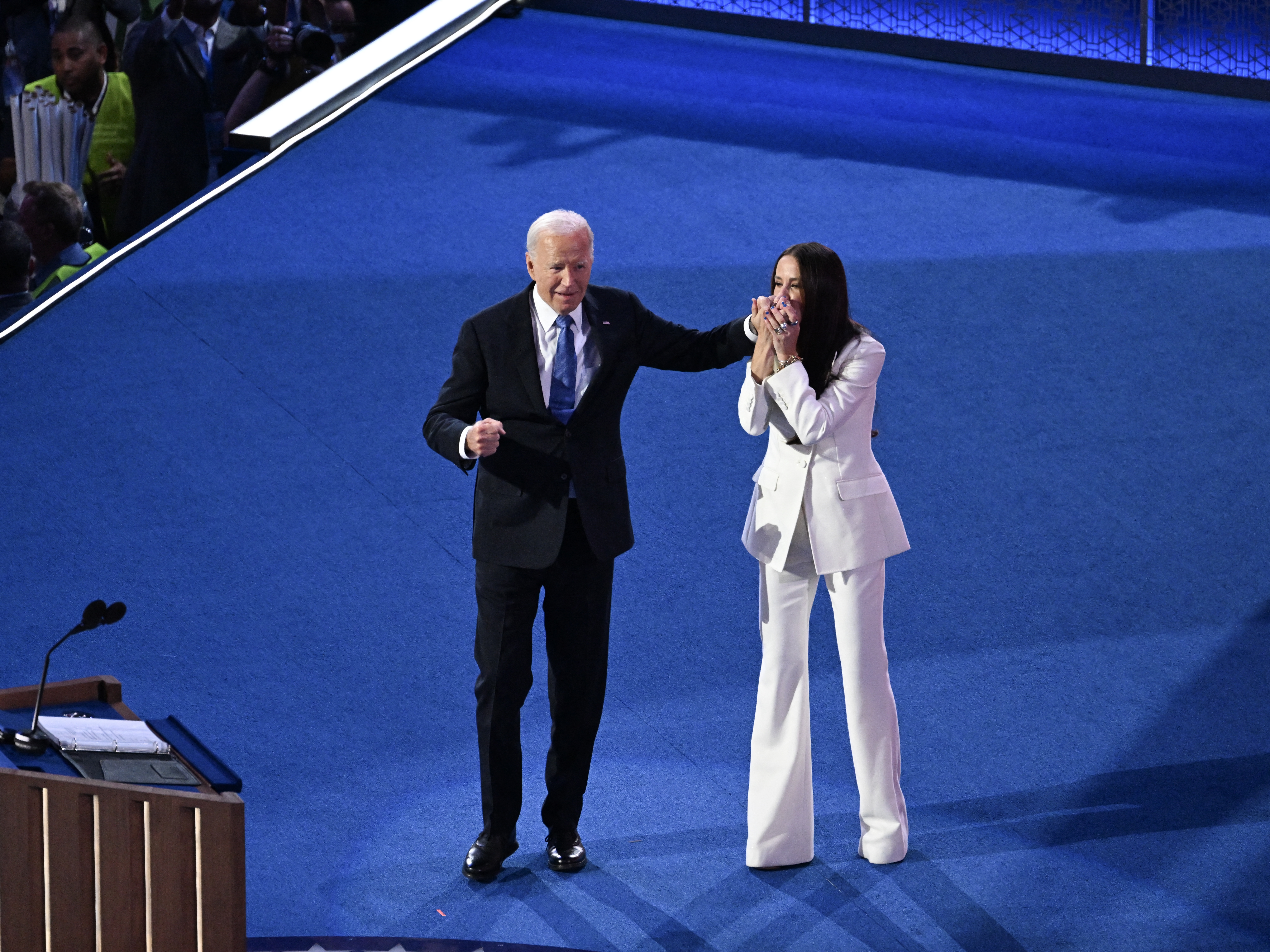 caption: Joe Biden arrives onstage after his daughter Ashley Biden introduced him.