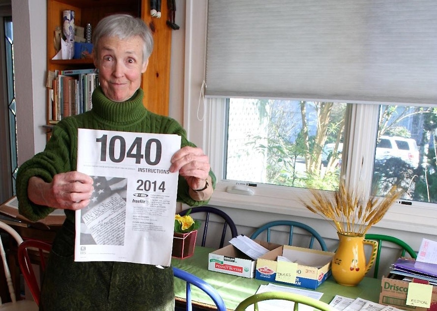 caption: Susan Dean, 78, says doing her taxes by hand would be impossible without the IRS instruction booklet, which the IRS no longer widely distributes.