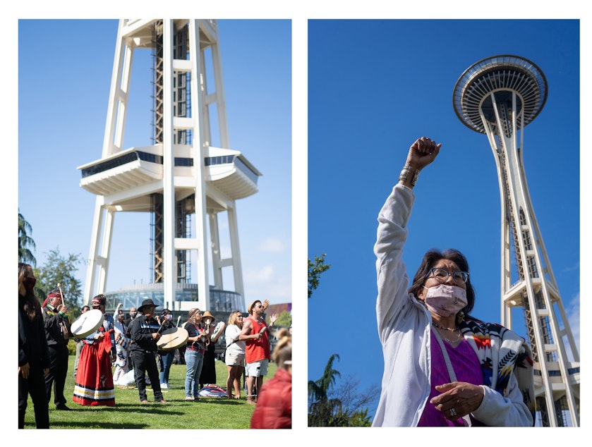caption: Left: The carvers of the Red Road to DC totem pole drum and sing traditional songs in all 4 directions near the Space Needle on Saturday, May 22, 2021, in Seattle. Right: A woman who identifies as a survivor of domestic violence raises her fist in the air. 
