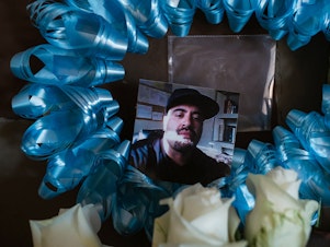 caption: A photo of Jeffrey Ramirez is seen at his parents' home in Vista, California. He was diagnosed with cancer while in prison and died at age 41.