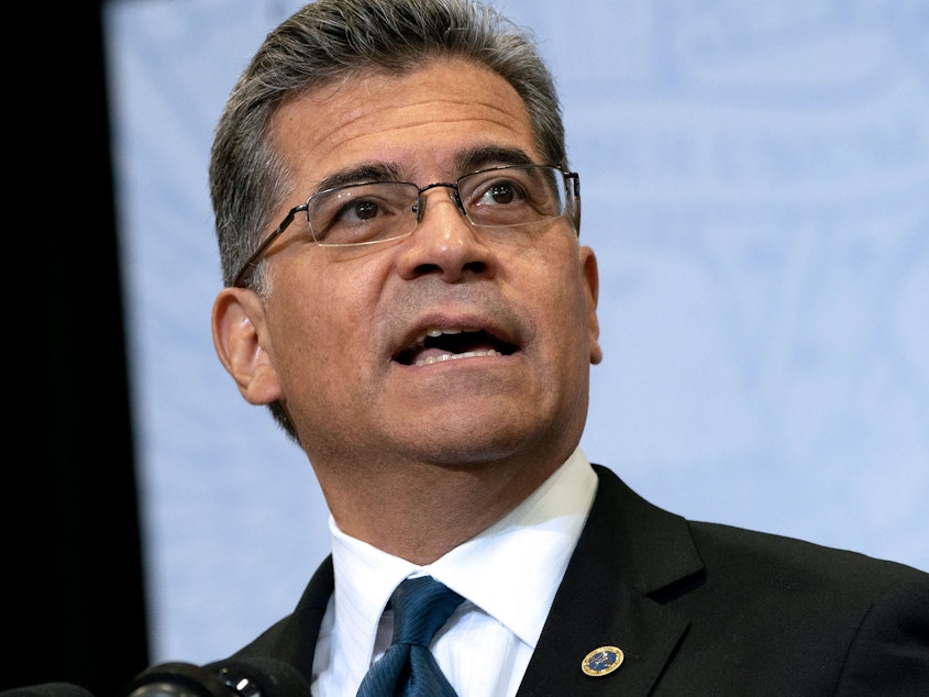 caption: HHS Secretary Xavier Becerra says doctors in Congress who are balking at the rules of the "No Surprises Act" aren't looking out for patients. "I don't think when someone is overcharging, that it's going to hurt the overcharger to now have to [accept] a fair price," Becerra says. The Congressional Budget Office estimates the Biden team's rules would push insurance premiums down by 0.5% to 1%.