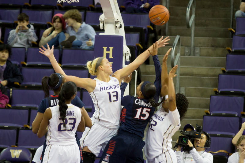 caption: UW junior #13 Katie Collier, center, was diagnosed and treated for leukemia in 2011 and is now cancer free.