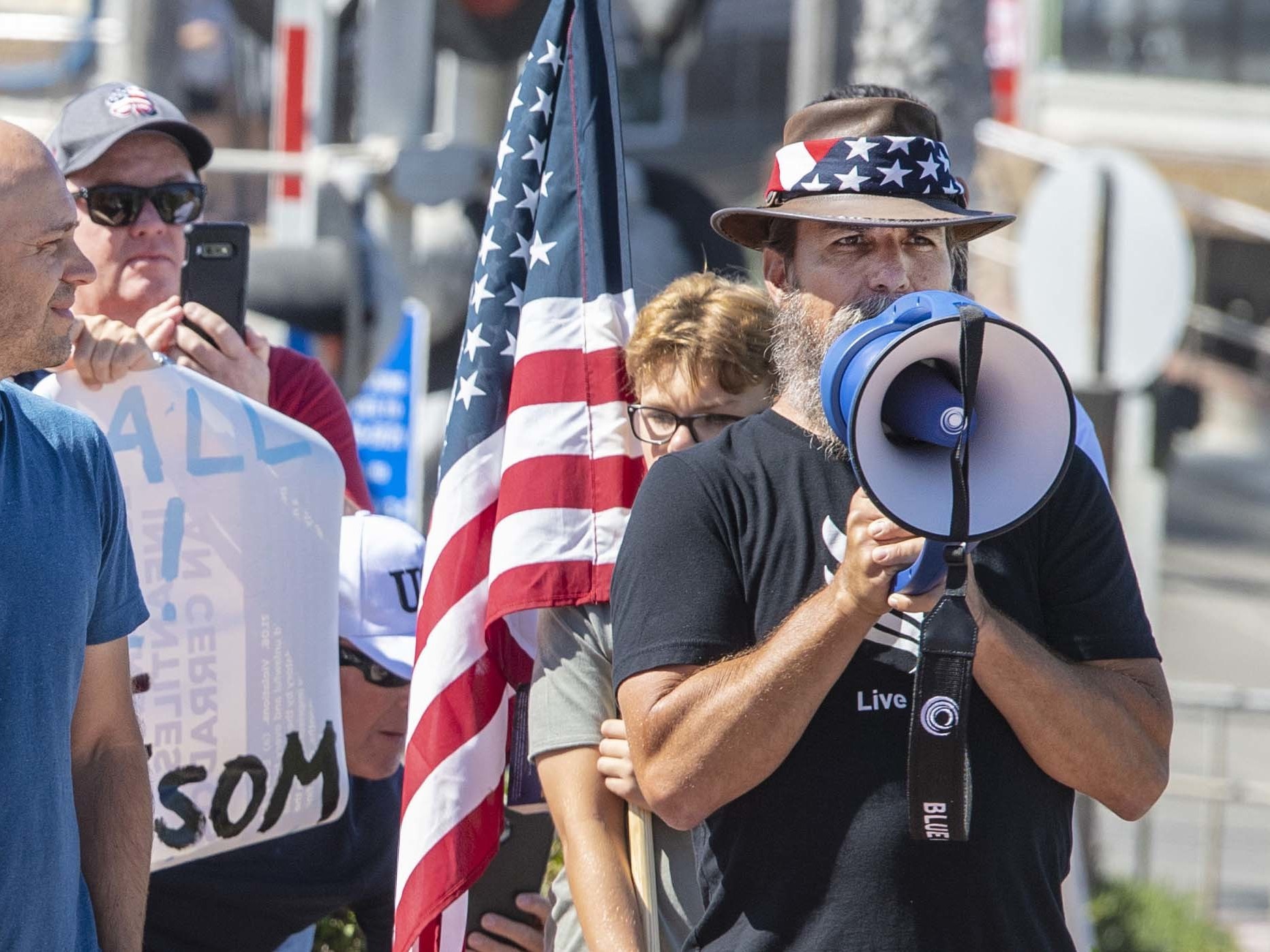 caption: Alan Hostetter, seen here in May 2020, became a leading activist against coronavirus-related lockdown policies in Orange County, Calif. Hostetter, a former police chief and yoga instructor, was convicted of conspiring to obstruct congress' certification of the 2020 presidential election results at the Jan. 6, 2021, riot at the U.S. Capitol.
