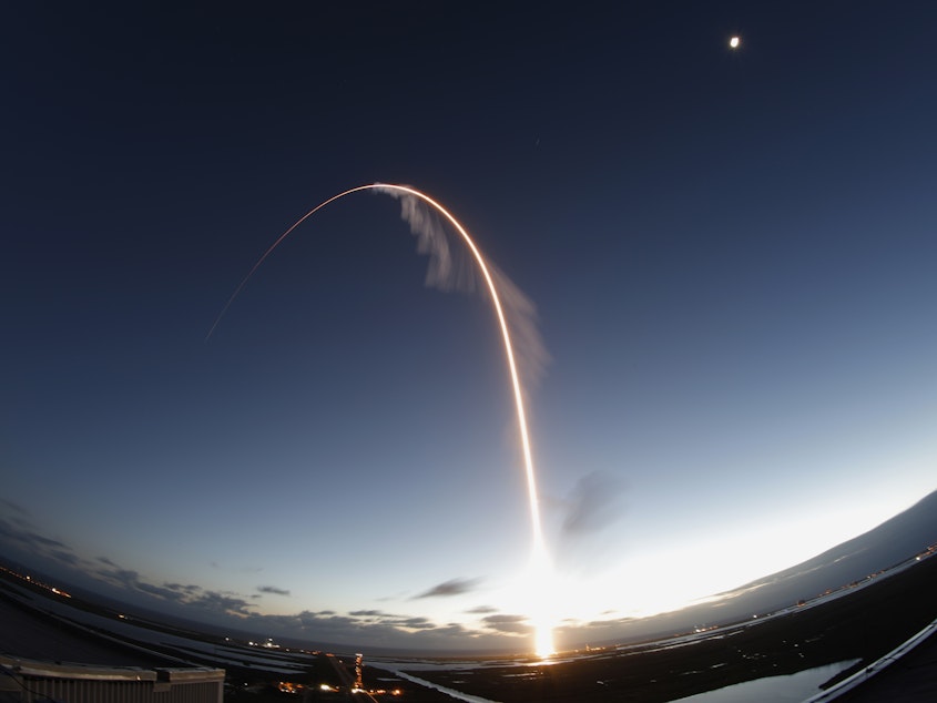 caption: A time exposure of the United Launch Alliance Atlas V rocket carrying the Boeing Starliner crew capsule on an Orbital Flight Test to the International Space Station lifts off from Space Launch Complex 41 at Cape Canaveral Air Force station, on Friday.