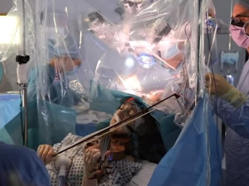 caption: Dagmar Turner recently played her violin during brain surgery in London. "The violin is my passion," she said in a statement. "I've been playing since I was 10 years old."