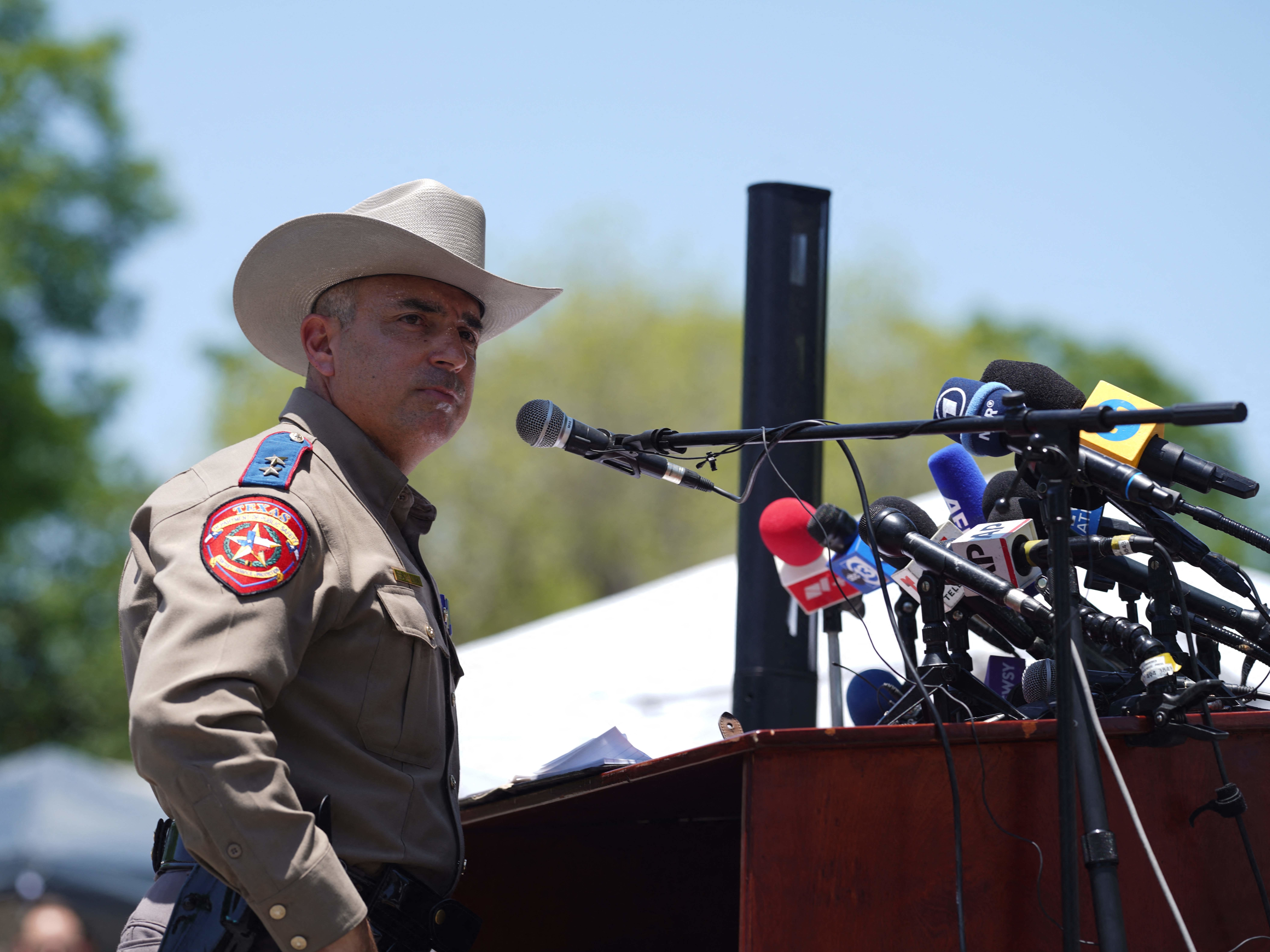 caption: Victor Escalon, a regional director with the Texas Department of Public Safety, gives a news conference in Uvalde on Thursday.