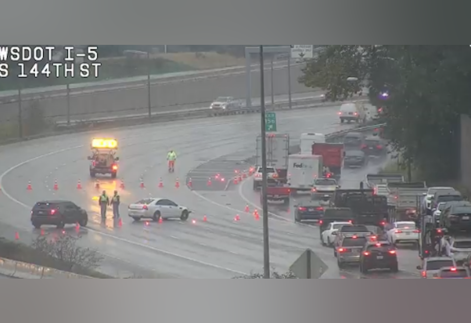 caption: The Washington State Patrol and Department of Transportation closed I-5 near Tukwila and re-routed traffic off the freeway after a semi crash on Wednesday, October 20, 2021. Both agencies lost hundreds of workers as a result of Gov. Jay Inslee's COVID-19 vaccine mandate.