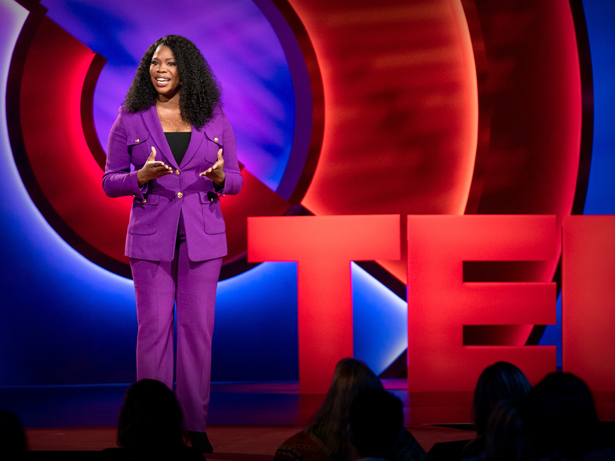 caption: Jasmine Crowe Houston speaking at TED in 2019