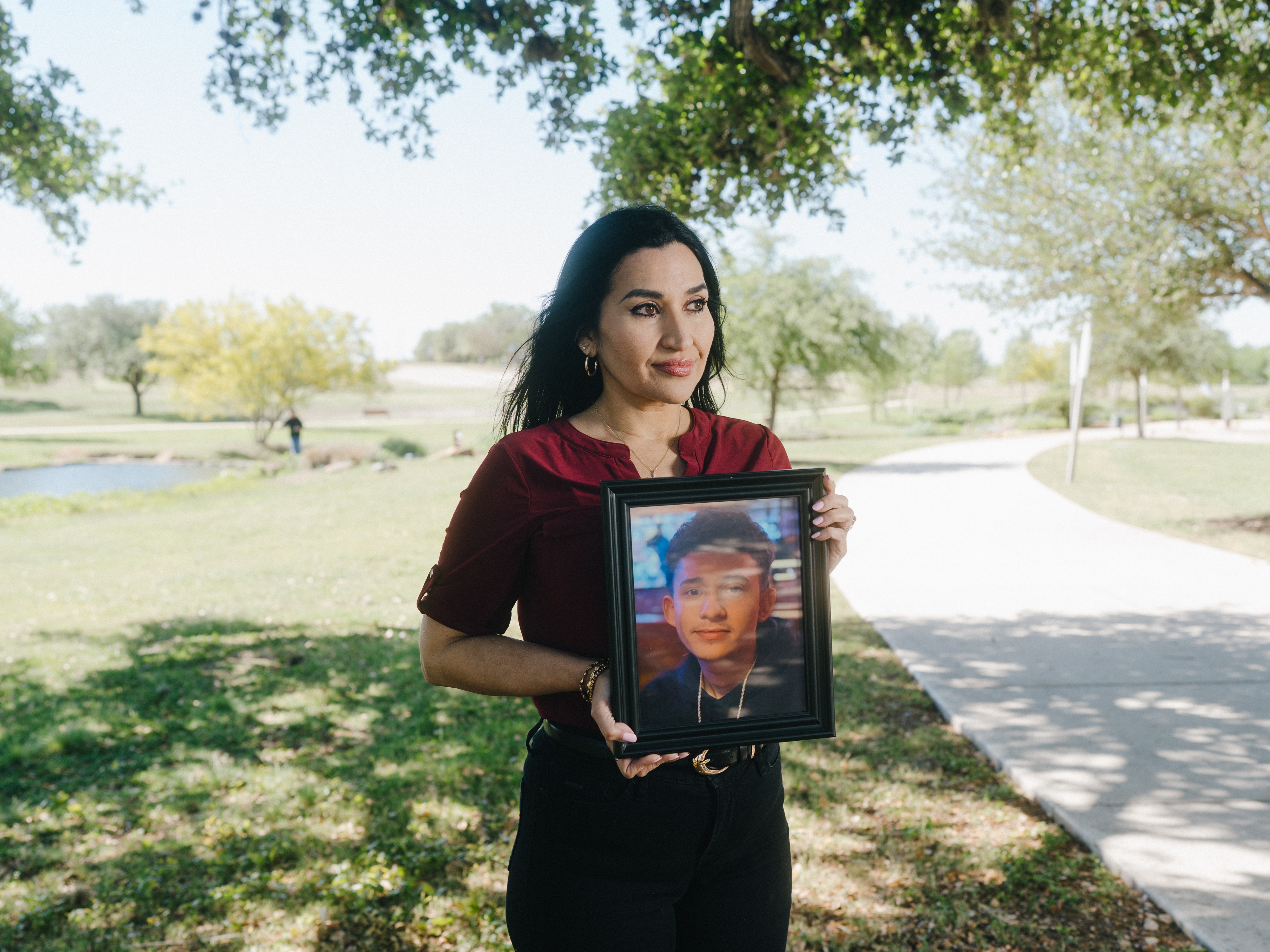 caption: Rachel Reyes, holds a photo of her son, Ruben Ray Martinez, a U.S. citizen who was shot and killed by an Immigration and Customs Enforcement agent during a traffic encounter in Texas.